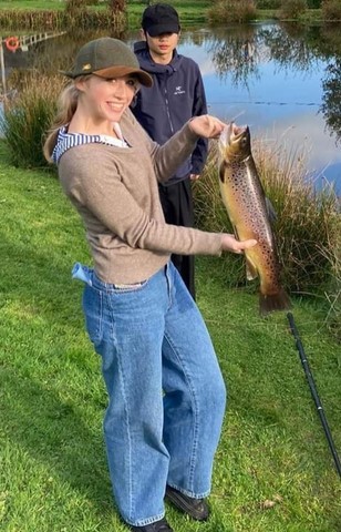Lucy holding up a 4lb Brown Trout